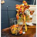 centerpiece fall with pumpkin candle and a bow. An exclusive deal for a luxurious decor